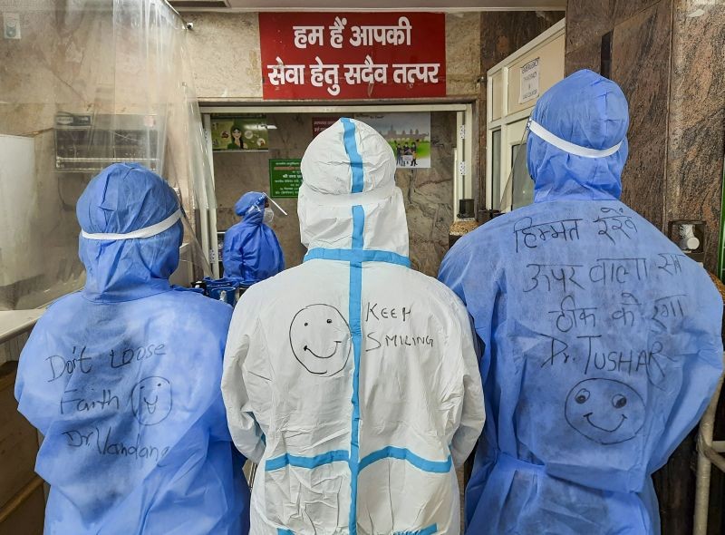Doctors' names written on the back of their PPE kits to help COVID-19 patients in identifying them, at Government Institute of Medical Sciences in Greater Noida. (PTI Photo)