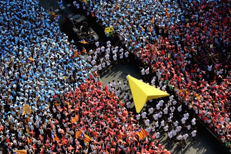 Tens of thousands of people gather in Barcelona to demand for Catalonia's independence during the Catalonia National Day at Meridiana Avenue in Barcelona, Spain on Sept. 11, 2015. (IANS File Photo)