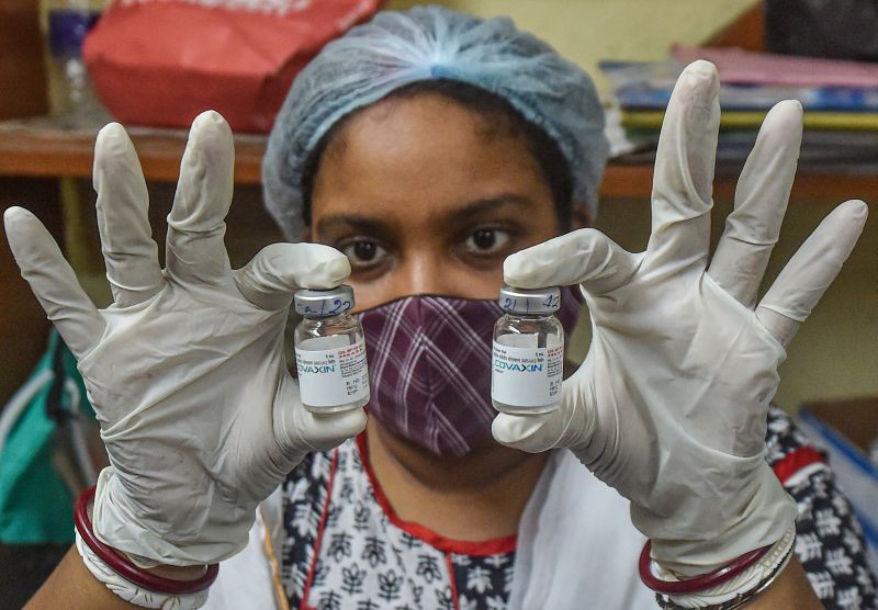 A health worker shows the vials fo Covaxin dose, at a vaccination centre in Kolkata on June 22, 2021. (PTI Photo)