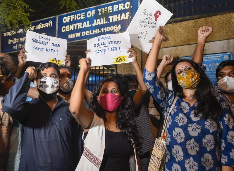 Student activists Natasha Narwal, Devangana Kalita and Asif Iqbal Tanha outside Tihar prison, after a court ordered their immediate release in the north-east Delhi riots "conspiracy" case, in New Delhi, on June 17, 2021.  They were arrested in May last year under the stringent Unlawful Activities (Prevention) Act (UAPA). (PTI Photo)