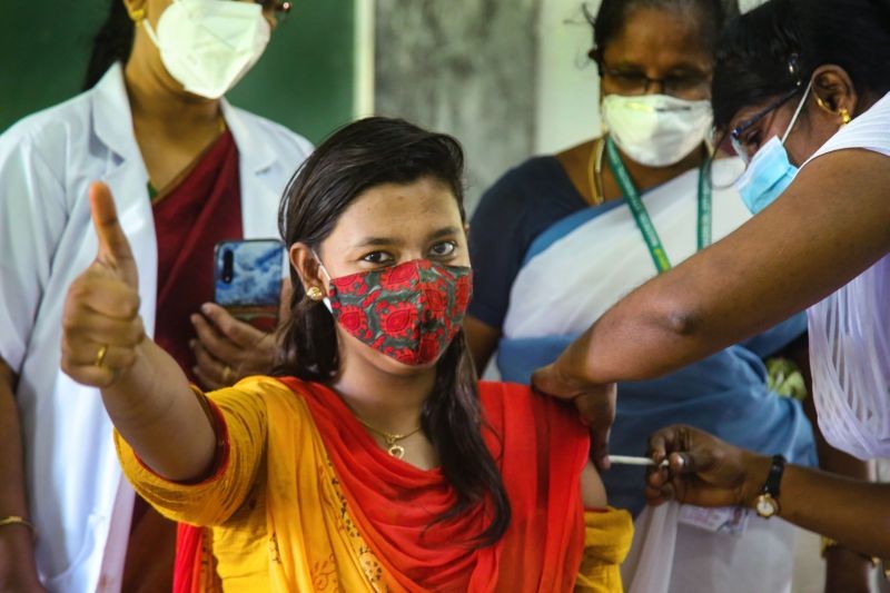 A woman shows thumbs up as she receives a dose of the COVID-19 vaccine, at a vaccination camp organised by Nagercoil Municipal Corporation, at Hindu college in Kanyakumari district on  June 7, 2021. (PTI Photo)