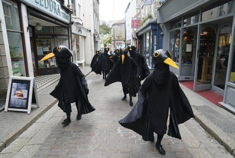 St. Ives: Members of Extinction Rebellion are dressed as birds as they 'sound the alarm' while marching through the town of St. Ives, Cornwall, England, Friday, June 11, 2021. Leaders of the G7 begin their first of three days of meetings on Friday in Carbis Bay, in which they will discuss COVID-19, climate, foreign policy and the economy. AP/PTI