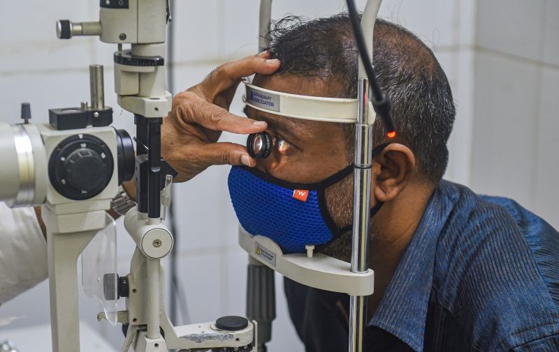 A doctor examines a patient inside Mucormycosis OPD at NMMC hospital, Vashi in Navi Mumbai on June 1, 2021.  (PTI Photo)