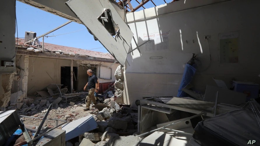 FILE - A man walks through a heavily damaged hospital in the city of Afrin, Syria, June 13, 2021. AP Photo
