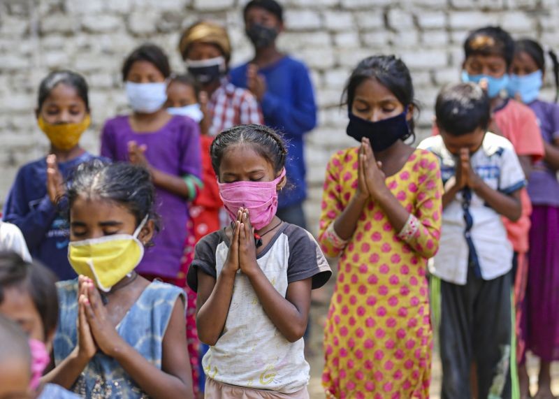 Children of slum dwellers attend class organised by social activist Kanchan Sharma during relaxation hours of Covid-19 lockdown, in a locality in Jammu on June 17, 2021. (PTI Photo)