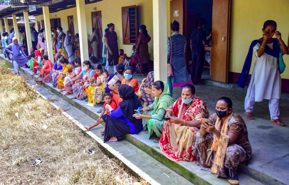 Nagaon: Beneficiaries wait in a queue to receive COVID-19 vaccine dose, at a centre in Nagaon district of Assam, Tuesday, June 22, 2021. (PTI Photo)