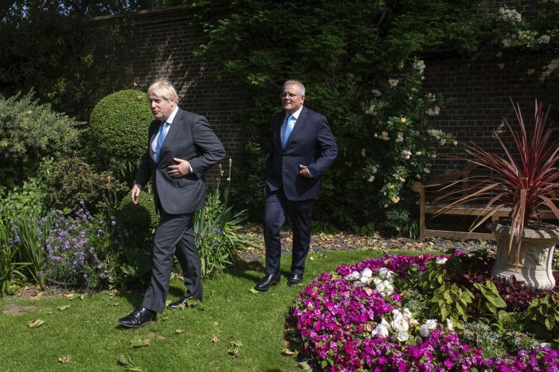 Britain's Prime Minister Boris Johnson, foreground, walks with Australian Prime Minister Scott Morrison after their meeting, in the garden of 10 Downing Streeet, in London on June 15, 2021. Britain and Australia have agreed on a free trade deal that will be released later Tuesday, Australian Trade Minister Dan Tehan said.  (AP/PTI Photo)