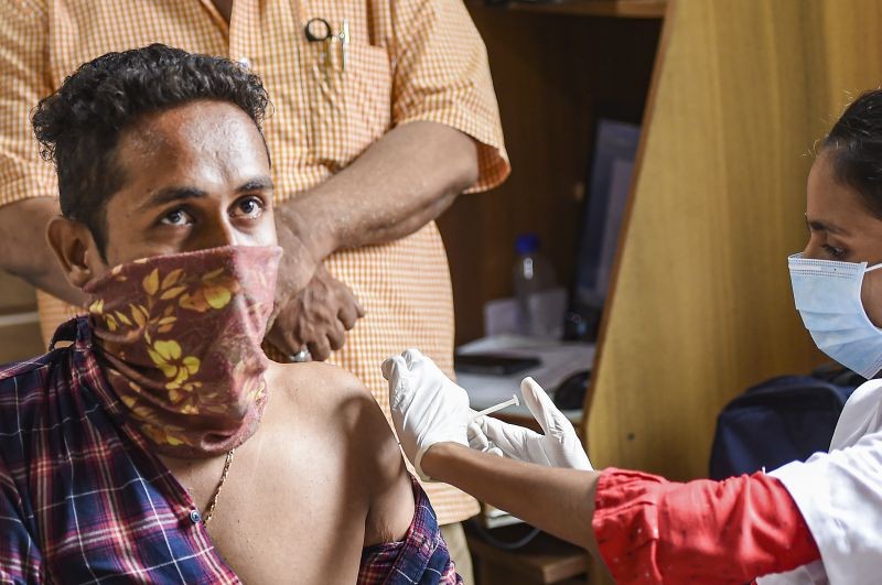 Navi Mumbai: A vegetable vendor receives a dose of COVID-19 vaccine, at APMC Market at Vashi, in Navi Mumbai, Tuesday, June 15, 2021. (PTI Photo/Kunal Patil)(