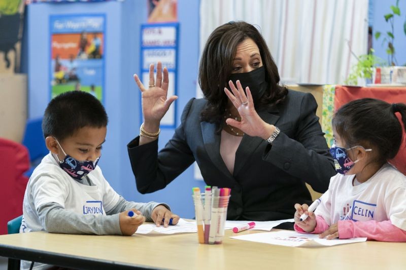 Washington : Vice President Kamala Harris joins bilingual early childhood education school CentroNia pupils ÔªøJayden Vello, left, and Celina Barrera, right, as they work on their project during a visit to the school, Friday, June 11, 2021 in northwest Washington. Harris talked about child tax credit during the visit. AP/PTI