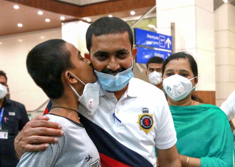 Becks Krishnan, 45, a native of Puthenchira in Thrissur district, reunites with his family after being saved from death row in Abu Dhabi jail, at Kochi International airport, Kochi on June 9, Krishnan has been languishing in Al Wathba prison in Abu Dhabi for the past seven years in a car accident case. (PTI Photo)