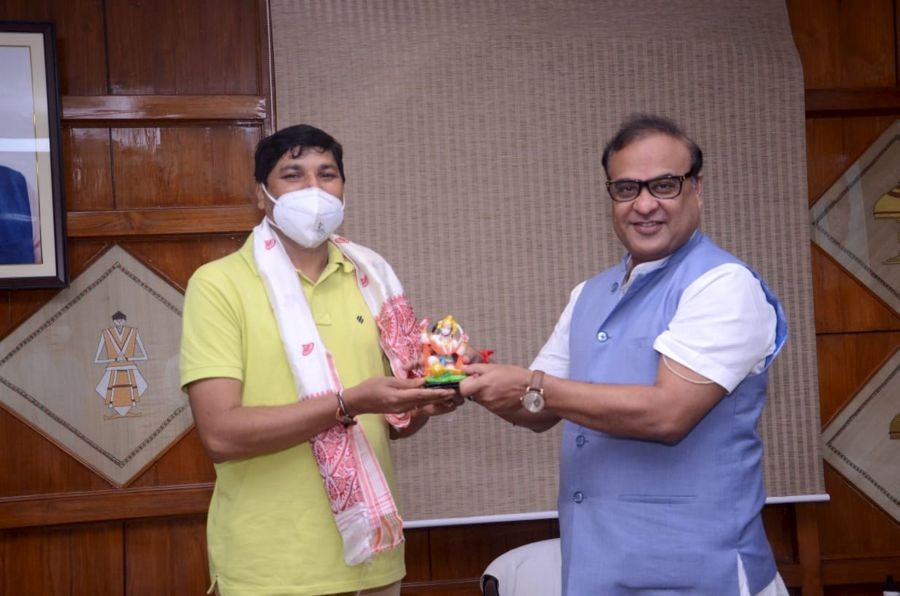 Guwahati: Assam Chief Minister Dr. Himanta Biswa Sarma felicitates newly appointed BJP President of the state, Bhabesh Kalita during a meeting at Janata Bhawan in Guwahati, Saturday, June 26, 2021.(PTI Photo)
