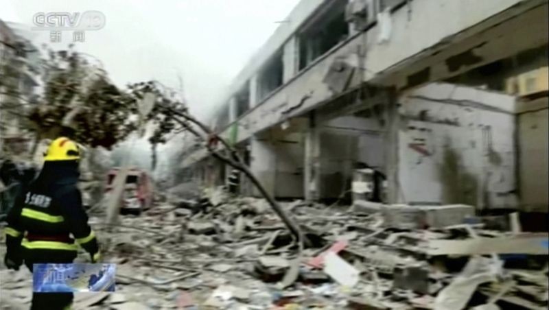 In this image taken from a video footage run by China's CCTV, a firefighter walks near the aftermath of a gas explosion in Shiyan city in central China's Hubei Province on June 13, 2021. At least a dozen people were killed and more seriously injured Sunday after a gas line explosion tore through the residential neighborhood in central China . (AP/PTI Photo)