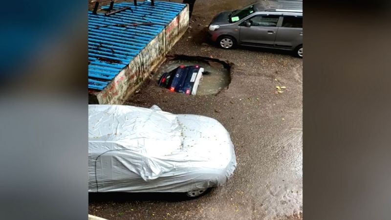 Car vanishes down well in Mumbai. (IANS Photo)