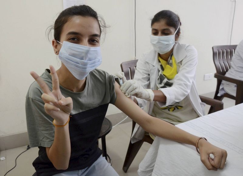 Amritsar: A medical worker inoculates a person with a dose of the Covishield vaccine, at a government hospital in Amritsar, Friday, June 18, 2021. (PTI Photo)