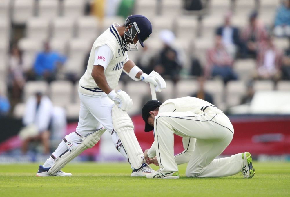 Southampton: A New Zealand player ties shoe laces of India's Ajinkya Rahane, left, during the third day of the World Test Championship final cricket match between New Zealand and India, at the Rose Bowl in Southampton, England, Sunday, June 20, 2021. AP/PTI(