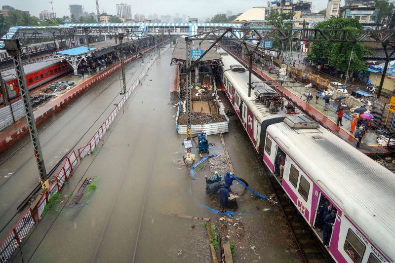 Waterlogged railway tracks at a station after heavy rains, in Thane on June 9. (PTI Photo)