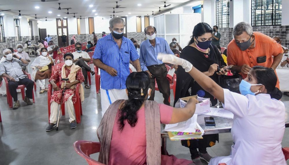 Kochi: Beneficiaries wait to receive the COVID-19 vaccine dose at a vaccination centre in Kochi, Thursday, June 03, 2021. (PTI Photo)