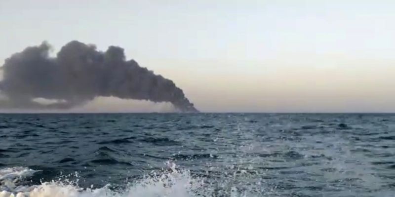 This image made from a video released on Wednesday, June 2, 2021 by Asriran.com, shows smoke rising from Iran's navy support ship Kharg in the Gulf of Oman. Kharg, the largest warship in the Iranian navy caught fire and later sank Wednesday in the Gulf of Oman under unclear circumstances, semiofficial news agencies reported. (AP/PTI Photo)