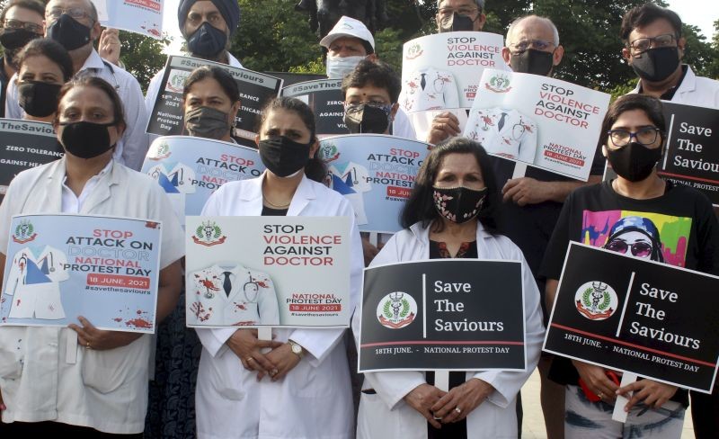 Doctors of Indian Medical Association (IMA) hold placards during a nationwide protest, demanding a central law to protect doctors against violence, in Gurugram on June 18, 2021. (PTI Photo)