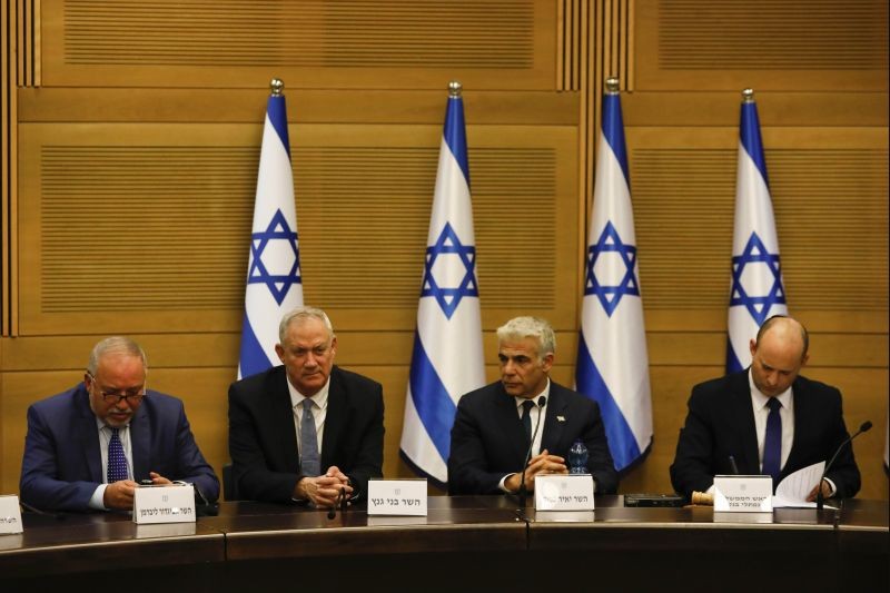 From the left, Avigdor Lieberman, Benny Gantz, Yair Lapid and Israel's new prime minister Naftali Bennett hold a first cabinet meeting in Jerusalem on June 13, 2021. Israel's parliament has voted in favor of a new coalition government, formally ending Prime Minister Benjamin Netanyahu's historic 12-year rule. Naftali Bennett, a former ally of Netanyahu became the new prime minister. (AP/PTI Photo)