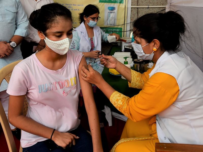 A medic administers a dose of COVID-19 vaccine during a vaccination drive  Sanjeevani @ Your Doorstep , organised at Tihar Jail Residential Complex in association with West Delhi administration, in New Delhi on June, 28, 2021. (PTI Photo)