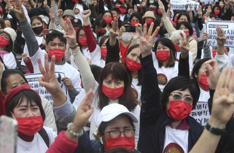 Myanmar nationals living in Taiwan make the three-finger salute of resistance as they attend a protest against the military regime in Myanmar during a demonstration at Liberty Square in Taipei, Taiwan. (AP/PTI File Photo)