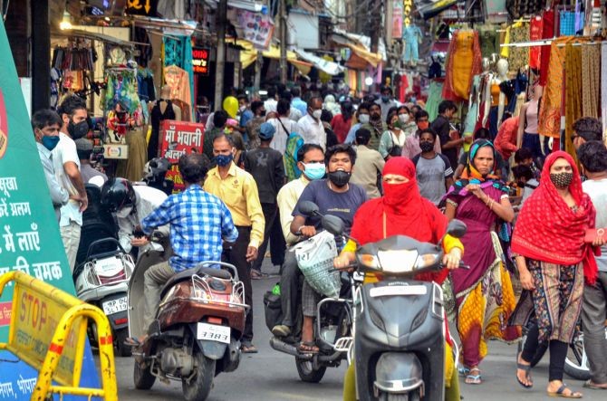 People throng a market that opened after two months as restrictions of COVID-19 lockdown eased in Bhopal. Photograph: PTI Photo