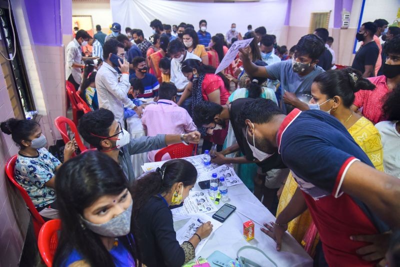 Beneficiaries arrive to receive a dose of COVID-19 vaccine during a special vaccination camp, at Vile Parle East in Mumbai on June 15, 2021. (PTI Photo)