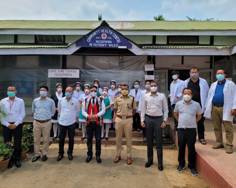 Nodal officer Y Kiheto Sema along with the DC,CMO,SP Dimapur pose for lens with SMO, CHC Medziphema Dr N Sezo and team after declaration of CCC Medziphema on June 4. (DIPR Photo)