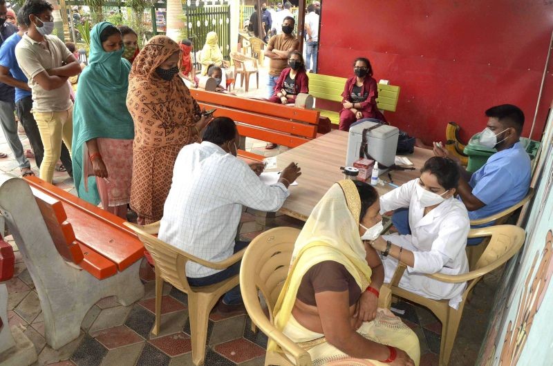 A medic inoculates a beneficiary with a COVID-19 vaccine in Bhopal on June 21,, 2021. (PTI Photo)