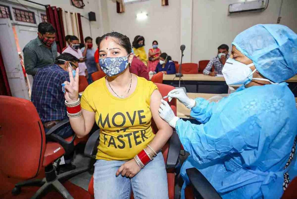 A beneficiary receives a dose of COVID-19 vaccine during a special vaccination camp, at Company Bagh in Jammu, Tuesday, June 15, 2021. (PTI Photo)