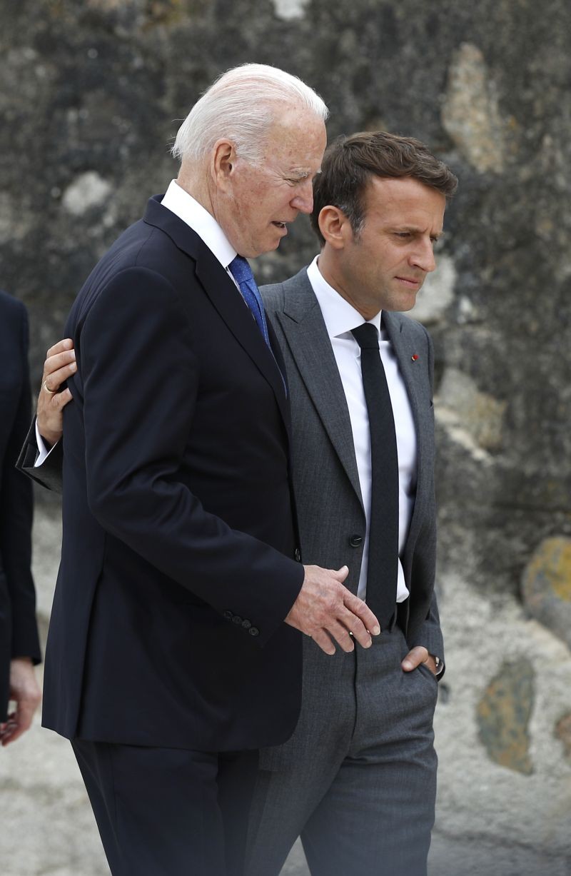 French President Emmanuel Macron, right, and U.S. President Joe Biden walk along the boardwalk during the G7 meeting at the Carbis Bay Hotel in Carbis Bay, St. Ives, Cornwall, England on Friday, June 11, 2021. (AP/PTI Photo)