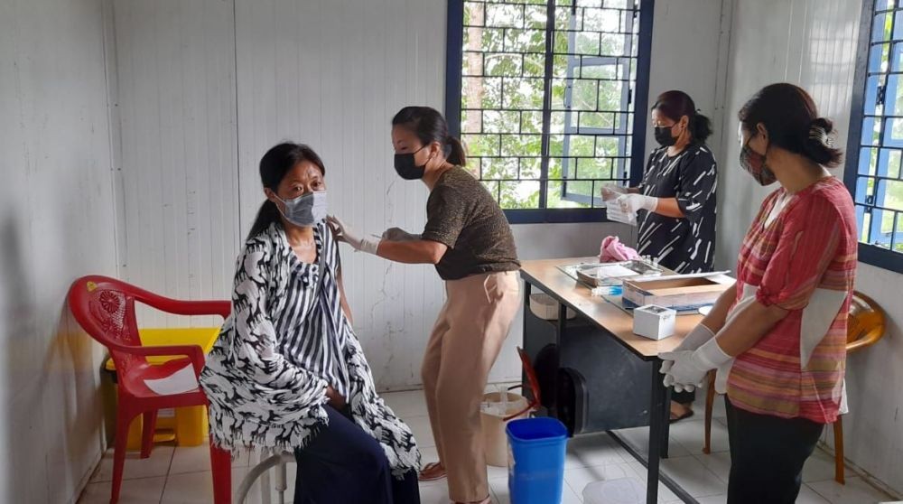 A beneficiary gets Covishield vaccine shot during the vaccination drive in Khensa village of Mokokchung district. (Photo Courtesy: KVC)