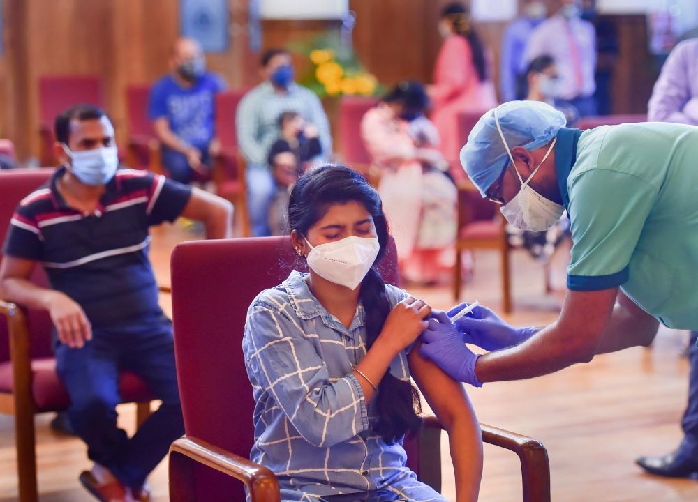 Bengaluru: A health worker administers a dose of the Covid-19 vaccine to a benificiary, in Bengaluru, Tuesday, June 1, 2021. (PTI Photo/Shailendra Bhojak)