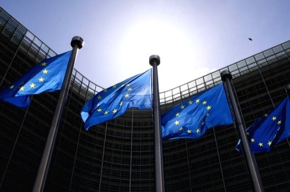 Flags of the European Union fly outside the EU headquarters in Brussels, Belgium, May 21, 2021. (IANS File Photo)