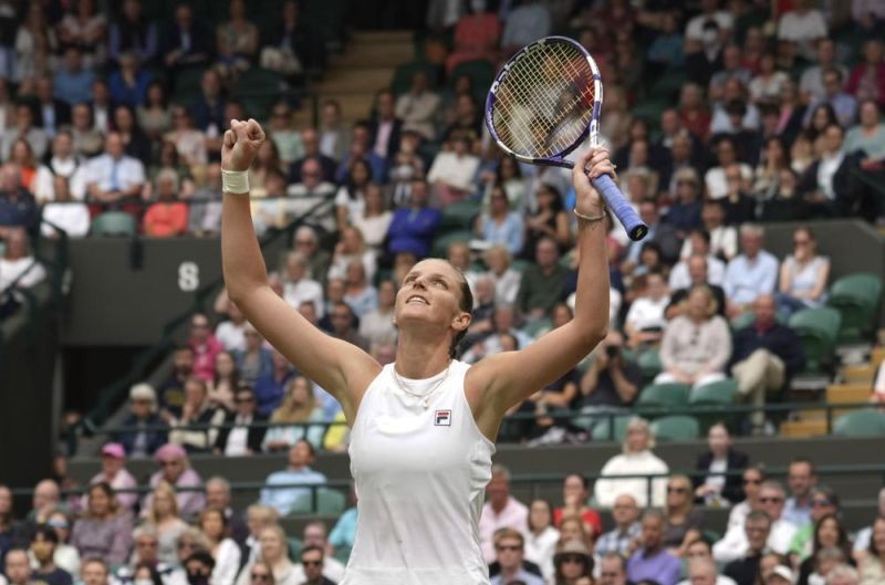 Czech Republic's Karolina Pliskova celebrates after defeating Switzerland's Viktorija Golubic during the women's singles quarterfinals match on day eight of the Wimbledon Tennis Championships in London, Tuesday, July 6, 2021. (AP Photo/Alberto Pezzali)