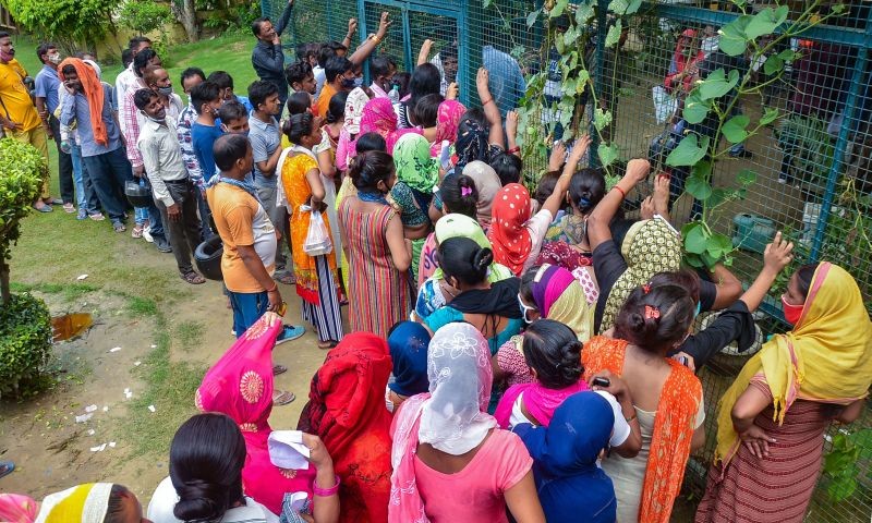 People, not adhering to COVID appropriate behaviour, wait to receive a dose of COVID-19 vaccine in Ghaziabad on July 29, 2021. (PTI Photo)