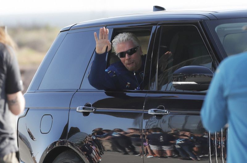 Virgin Galactic founder Richard Branson waves good bye while heading to board the rocket plane that will fly him to space from Spaceport America near Truth or Consequences, New Mexico on July 11, 2021. (AP/PTI Photo)