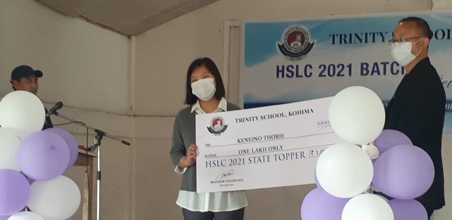 Keneino Thorie receives Rs 1 lakh from Trinity School Kohima on July 28. (Morung Photo)