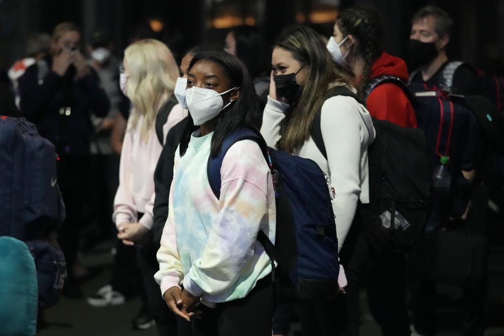 Simone Biles and the U.S. Women's Gymnastics team arrive for the Tokyo 2020 Summer Olympic Games at Narita International Airport Thursday, July 15, 2021, in Narita, east of Tokyo. (AP Photo/Kiichiro Sato)