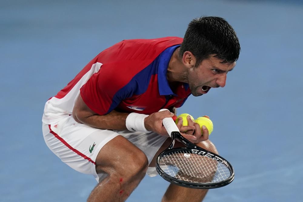 Novak Djokovic, of Serbia, reacts during a semifinal men s tennis match against Alexander Zverev, of Germany, at the 2020 Summer Olympics, Friday, July 30, 2021, in Tokyo, Japan. (AP Photo/Patrick Semansky)