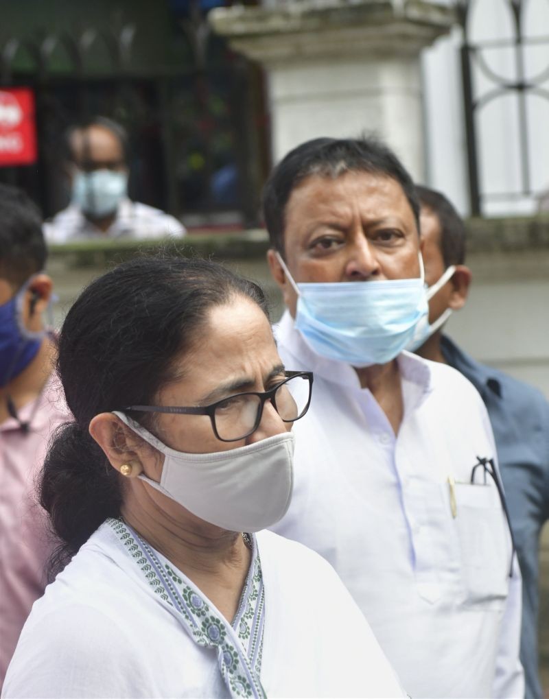 TMC supremo and West Bengal Chief Minister Mamata Banerjee meets party leader Mukul Roy to condole the demise of his wife, at his residence in Kolkata on July 6, 2021. (PTI Photo)