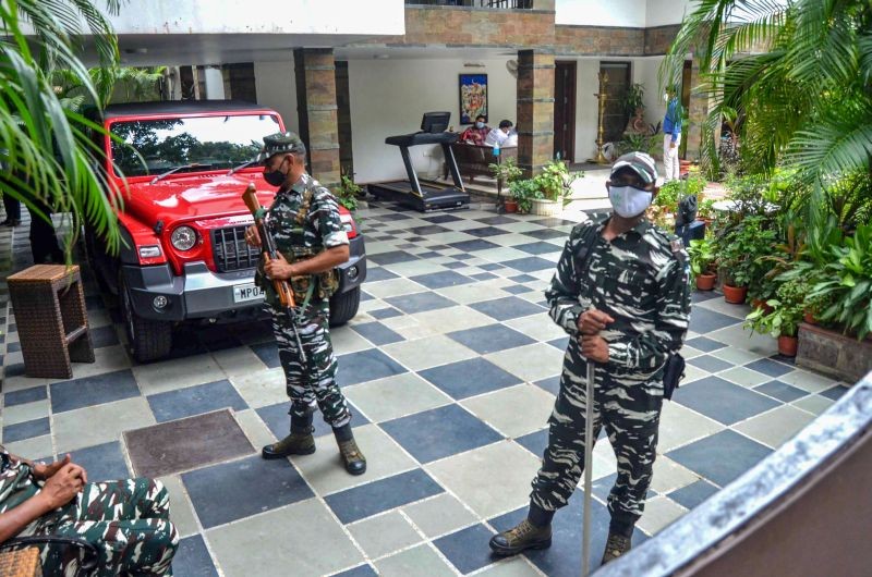 Security personnel stand guard at the residence of the owner of Dainik Bhaskar Group Sudhir Agarwal after Income Tax department raided his premises, in Bhopal on July 22, 2021. (PTI Photo)