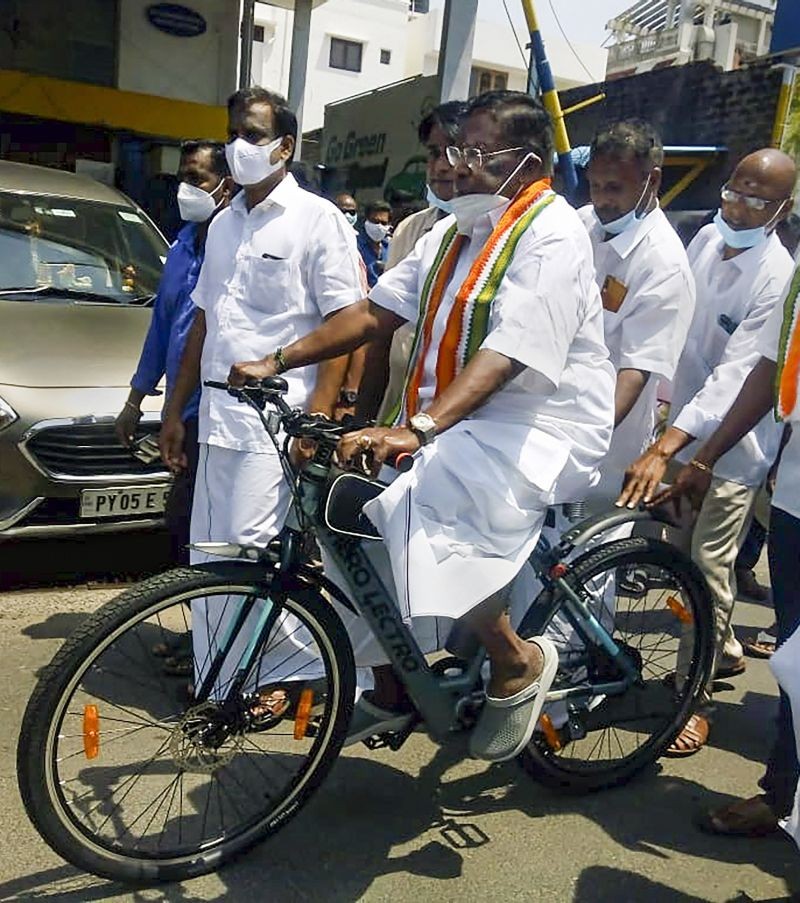 Former Puducherry CM V. Narayanasamy rides bicycle to protest against the fuel price hike, in Puducherry on July 7, 2021. (PTI Photo)