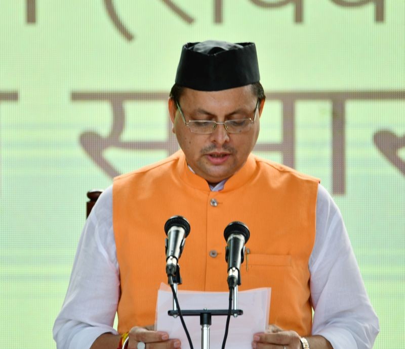 BJP MLA Pushkar Singh Dhami sworn- in as the Chief Minister of Uttarakhand during a swearing-in ceremony in Dehradun on July 4. (PTI Photo)