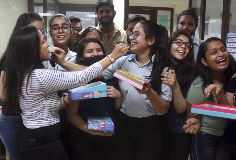 Students celebrate after CBSE declared class 12th results, at a school in Gurugram on July 30, 2021. (PTI Photo)