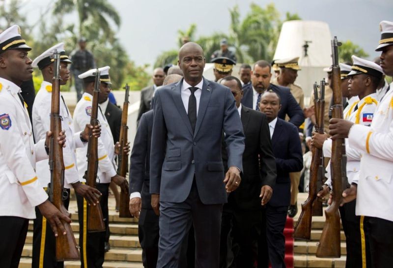 In this April 7, 2018, file photo, Haiti's President Jovenel Moise, center, leaves the museum during a ceremony marking the 215th anniversary of revolutionary hero Toussaint Louverture's death, at the National Pantheon museum in Port-au-Prince, Haiti. Mo¯se was assassinated after a group of unidentified people attacked his private residence, the country's interim prime minister said in a statement on July 7, 2021. (AP File Photo)