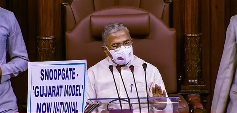 Protesting members place a placard in front of Dy Chairman Harivansh Narayan Singh as he conducts proceedings, during the Monsoon Session of Parliament, in New Delhi on July 27. (RSTV/PTI Photo)