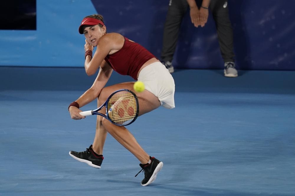 Belinda Bencic, of Switzerland, returns a shot to Marketa Vondrousova, of the Czech Republic, during the women's gold medal match of the tennis competition at the 2020 Summer Olympics, Saturday, July 31, 2021, in Tokyo, Japan. (AP Photo/Seth Wenig)