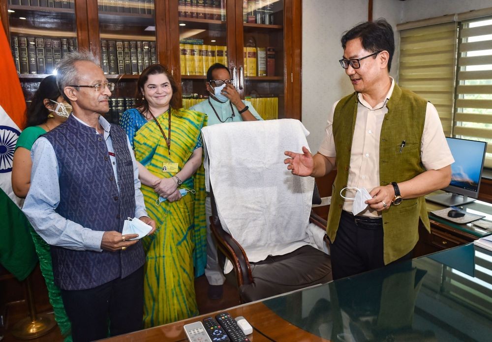 New Delhi: Union Minister for Law and Justice Kiren Rijiju interacts with officials while taking charge at his office, in New Delhi, Thursday, July 8, 2021. (PTI Photo/Manvender Vashist) (